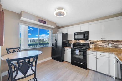 With Lake & Golf views... this corner 3 bdrm, 2 bath condo in - photo 11