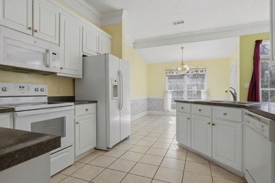 NEW PRICE! Welcome home to 104 Johns Drive, a timeless brick