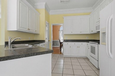 NEW PRICE! Welcome home to 104 Johns Drive, a timeless brick