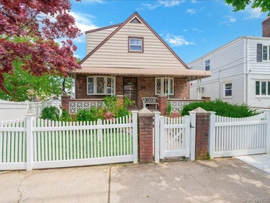 Welcome to this charming , Cape-style, single family home in the - photo 1