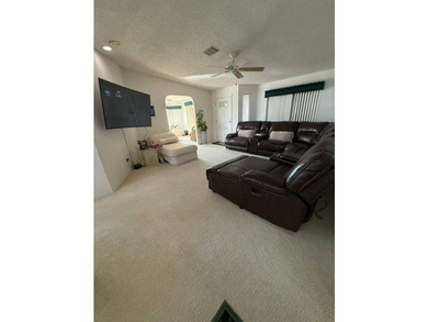 Experience luxury living in the sought-after The Hamptons Golf & - photo 3