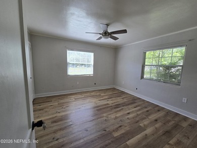 Home on half Acre lot centrally located. Features: New kitchen - photo 11