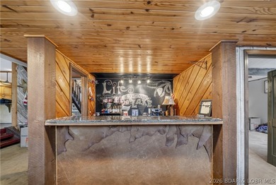 Discover a rare opportunity to own a truly distinctive lakefront - photo 12