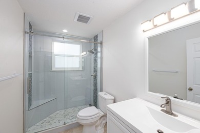 Beautifully remodeled 3BR/2BA heated saltwater pool home in - photo 18