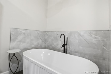 Experience elevated lake living in this new construction villa - photo 24