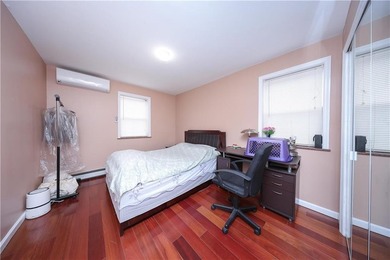 Introducing a beautifully maintained brick two-family home in - photo 14