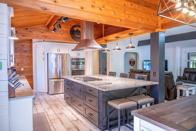 Enjoy 100 feet of owned frontage on Castle Rock Lake with this - photo 15