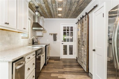 Enjoy lake living at its best in this updated home featuring - photo 4