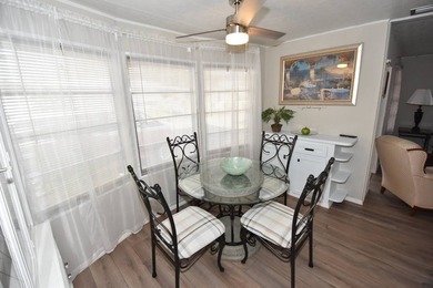 Charming 2-bedroom, 1.5-bath cottage-style mobile home located - photo 4