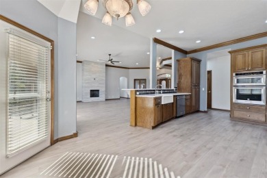 Located in a quiet cul-de-sac within a gated community, this