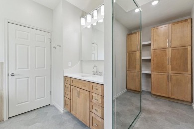 Located in a quiet cul-de-sac within a gated community, this