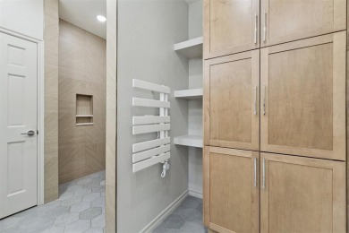 Located in a quiet cul-de-sac within a gated community, this