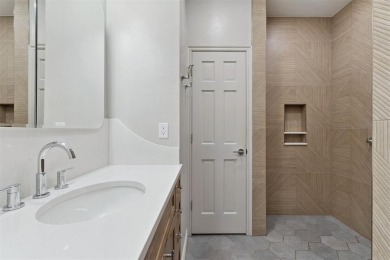 Located in a quiet cul-de-sac within a gated community, this