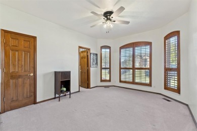 Located in a quiet cul-de-sac within a gated community, this