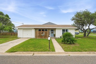Just three blocks from Aransas Bay, this beautifully updated - photo 2