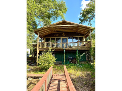 Enjoy lake life at its finest! This waterfront property offers - photo 1
