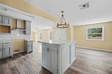Totally remodeled 3-bedroom,2-bathroom home located in the - photo 2