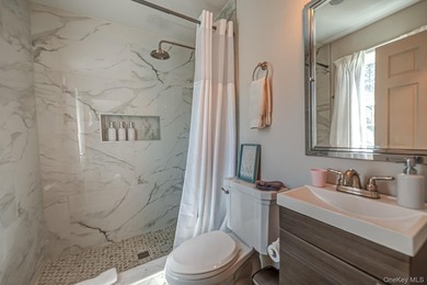 Ideally situated in the heart of Hampton Bays with walk-to- town - photo 34