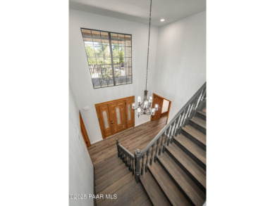 This beautifully remodeled 2-story brick and stucco home blends