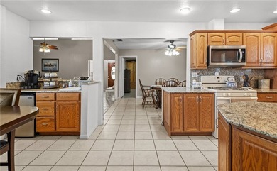 This 3-bed, 2-bath brick home sits on a large corner lot in an - photo 9
