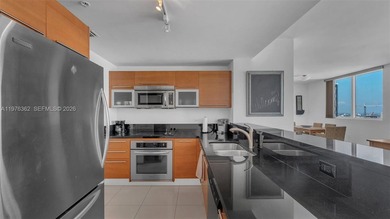 A must-see corner residence at Vizcayne Condominium featuring