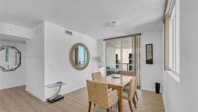 A must-see corner residence at Vizcayne Condominium featuring