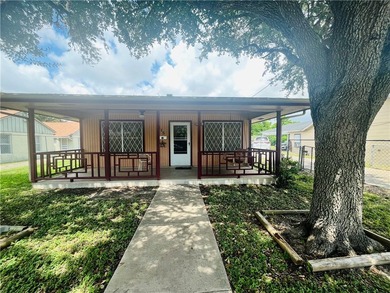 Charming investment opportunity meets endless potential. This - photo 1