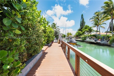 Located within a 24/7 guarded waterfront enclave and less than - photo 15