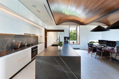 Located within a 24/7 guarded waterfront enclave and less than - photo 26