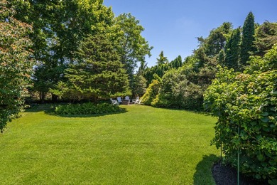 Tucked behind lush, mature landscaping, 52 Seagate is a verdant - photo 34