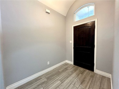 Nestled back in a private, gated community, this well taken care - photo 2
