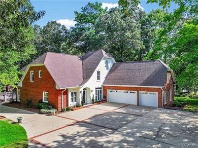 Nestled on a wooded golf course lot in the sought-after - photo 1