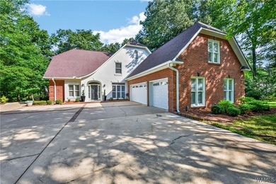 Nestled on a wooded golf course lot in the sought-after - photo 2