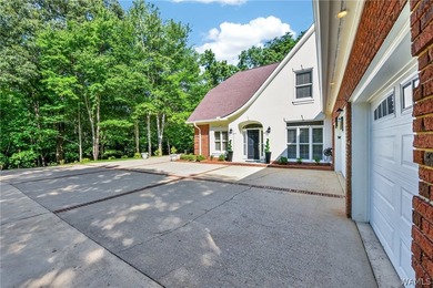 Nestled on a wooded golf course lot in the sought-after - photo 4