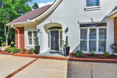 Nestled on a wooded golf course lot in the sought-after - photo 5
