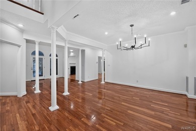 Nestled on a wooded golf course lot in the sought-after - photo 7