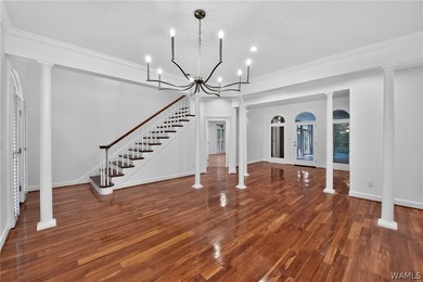 Nestled on a wooded golf course lot in the sought-after - photo 10