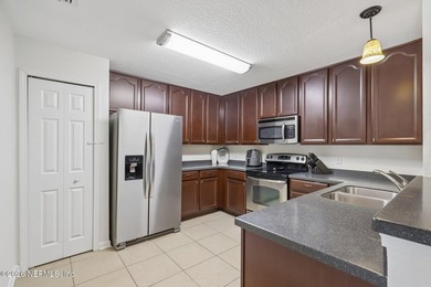 Beautifully maintained end-unit condo in the gated community of - photo 11