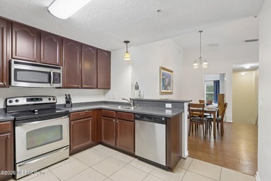 Beautifully maintained end-unit condo in the gated community of - photo 12