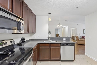 Beautifully maintained end-unit condo in the gated community of - photo 13