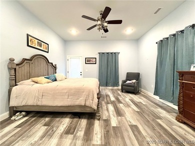 Spacious 1.20 acres and 80' of lakefront in a reg no wake cove - photo 9