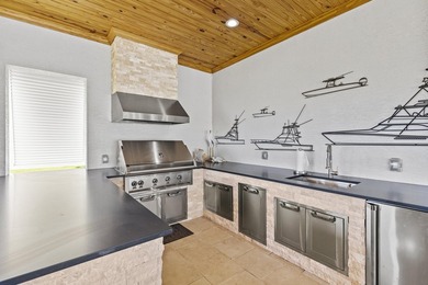 This architectural showpiece of coastal waterfront living - photo 16