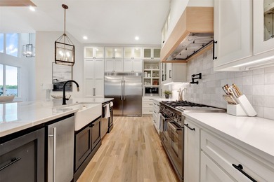 Luxury custom home in Heath, TX with soaring ceilings, walls of - photo 4