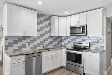 Welcome to 425 Bay Shore Drive, Unit 11, a stunning bayfront - photo 17