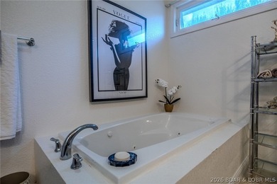 Welcome to this 4-bedroom, 3-bath lake-area-retreat with - photo 18