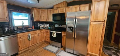 Tucked away at 567 Dale Trail in Menlo, GA, this isn't just a - photo 18