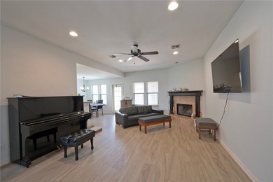 Step into this versatile 3-bedroom, 2-bath home in the highly - photo 2