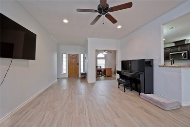 Step into this versatile 3-bedroom, 2-bath home in the highly - photo 3