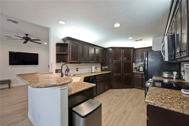Step into this versatile 3-bedroom, 2-bath home in the highly - photo 4