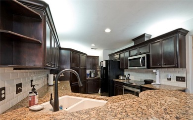 Step into this versatile 3-bedroom, 2-bath home in the highly - photo 6